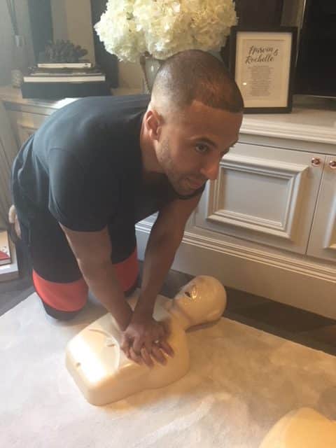 Marvin Humes practices CPR on a manikin